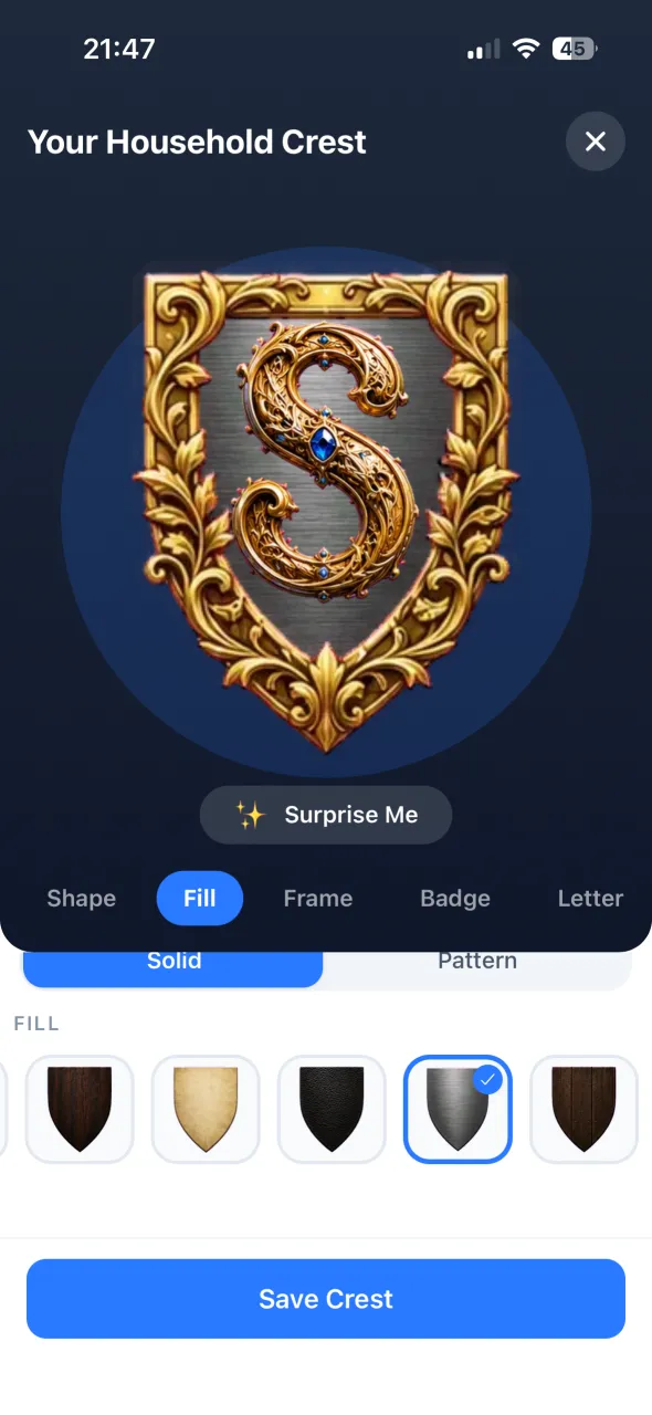 The household crest designer: a gold-framed shield with the family's initial.